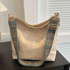 Elegant Cream Cross Body Bag with Patterned Guitar Strap; NWOT